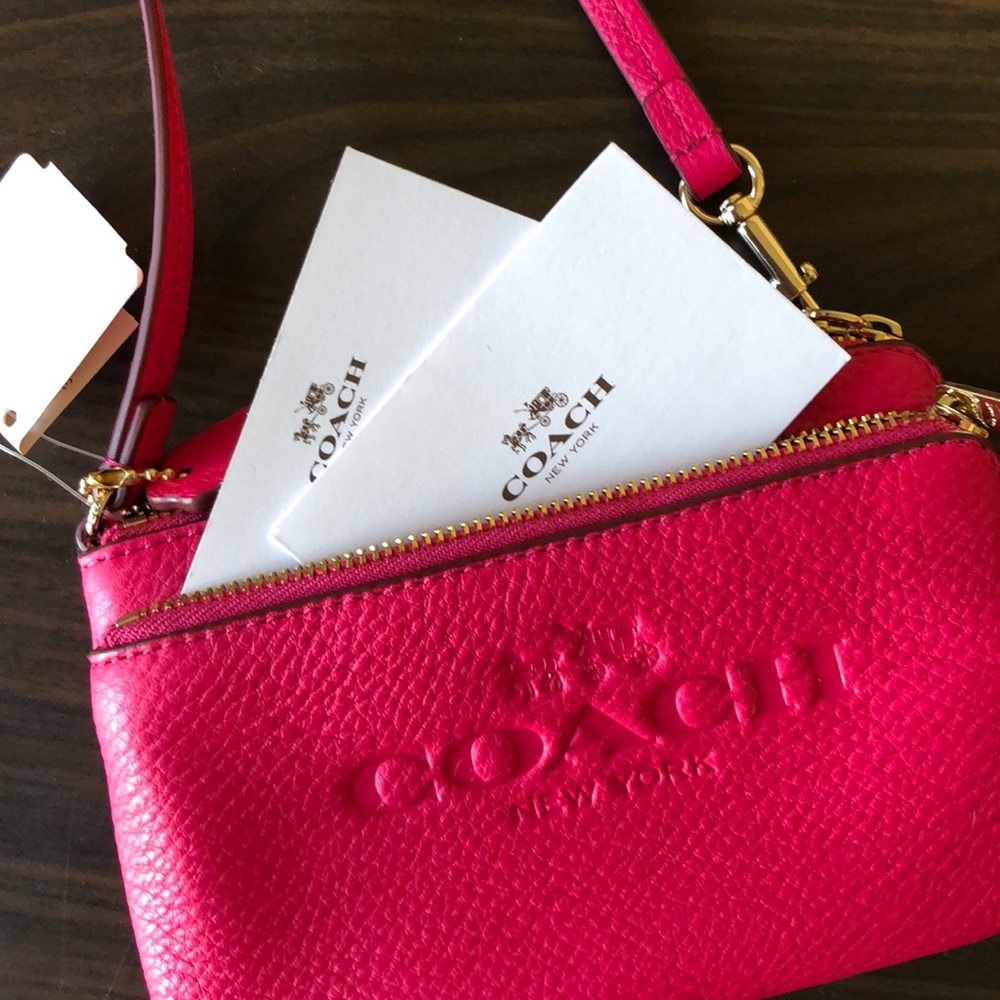 COACH hot pink wristlet